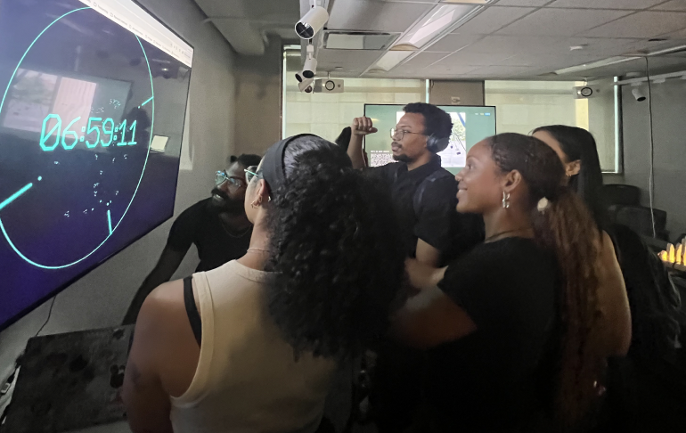 A group watching a countdown timer on an interactive screen