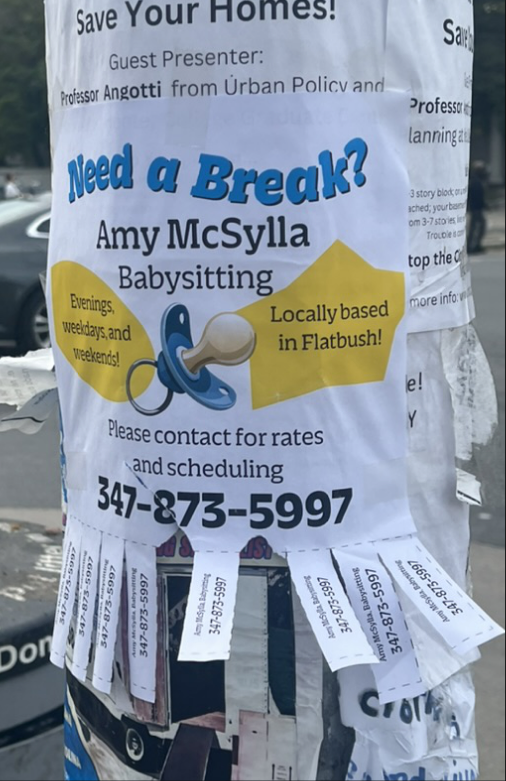 Street lamppost photo of a babysitting flyer with tear-off tabs
